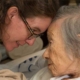 a Hospice nurse and patient share an intimate moment